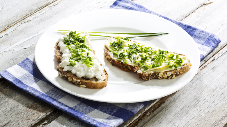 Toast with cottage cheese on plate