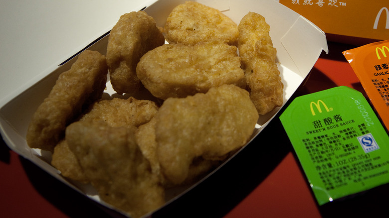 carton of McNuggets with sauce