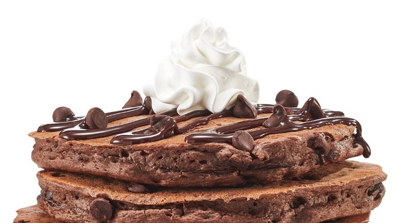 chocolate chocolate chip pancakes with whipped cream