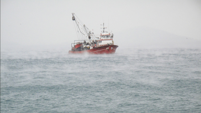 fishing boat on waves