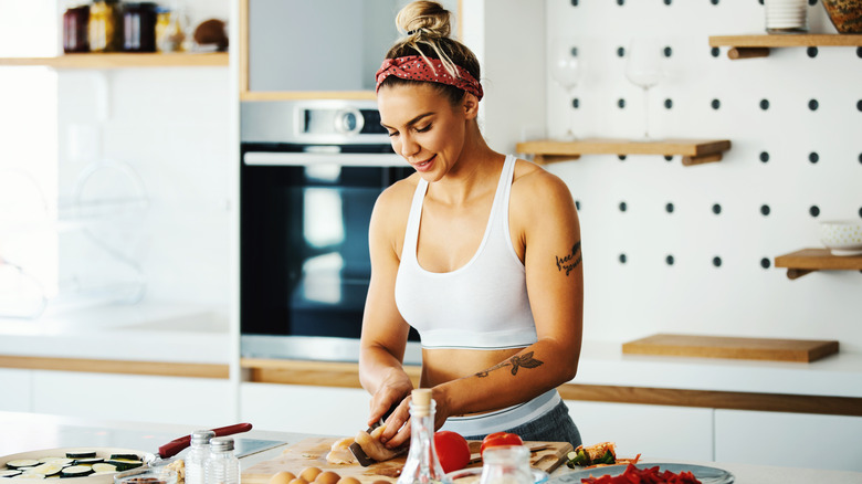 woman filleting chicken