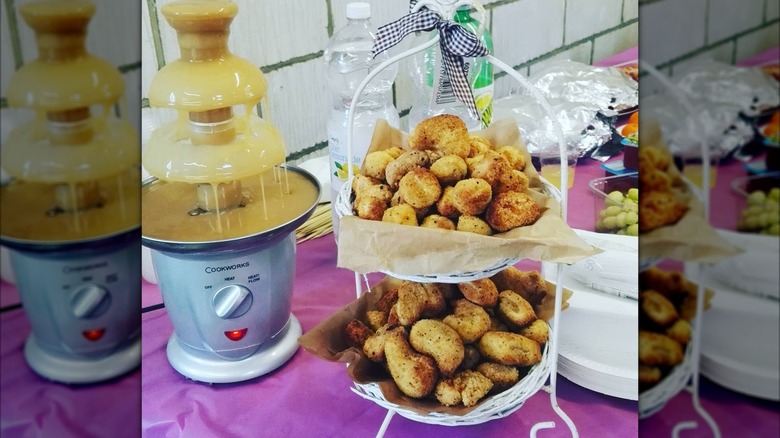 Gravy fountain and chicken croquettes on counter