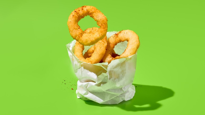 Fried onion rings in a paper bag