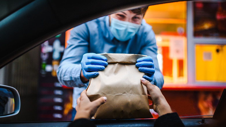 Fast food worker with mask