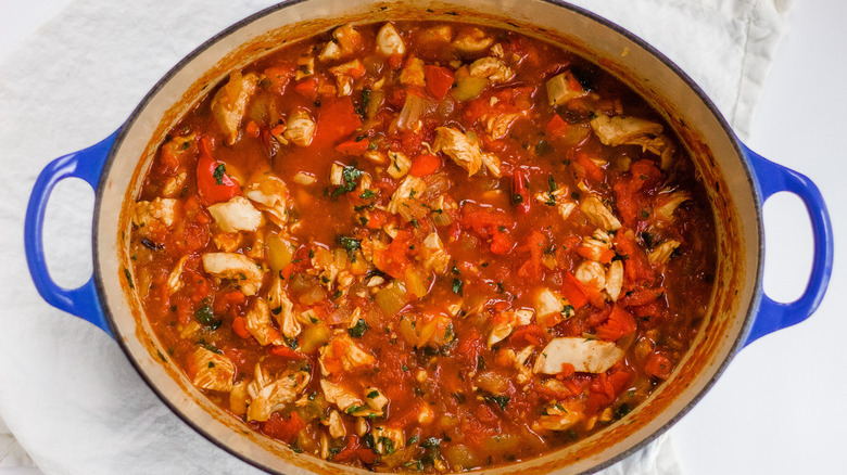 Chicken chili in dutch oven pot with cilantro