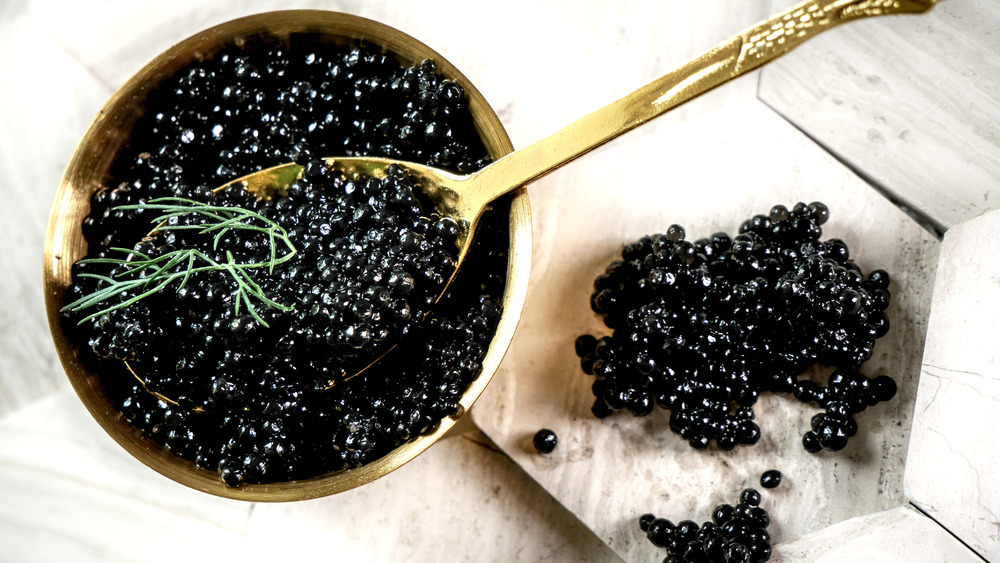 Caviar in gold bowl