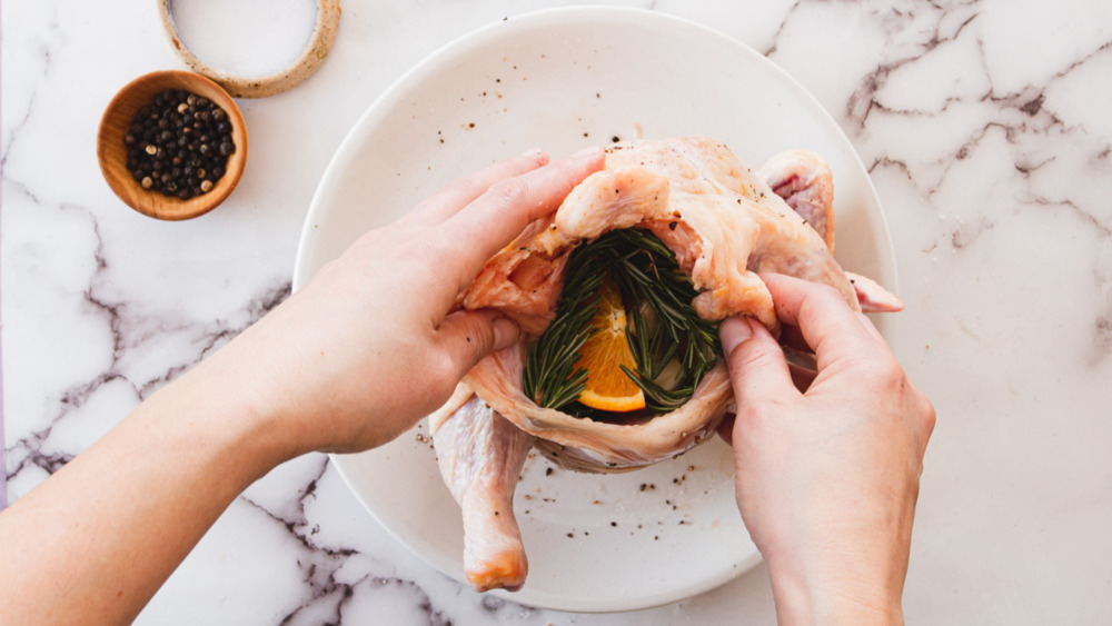 stuffing a chicken