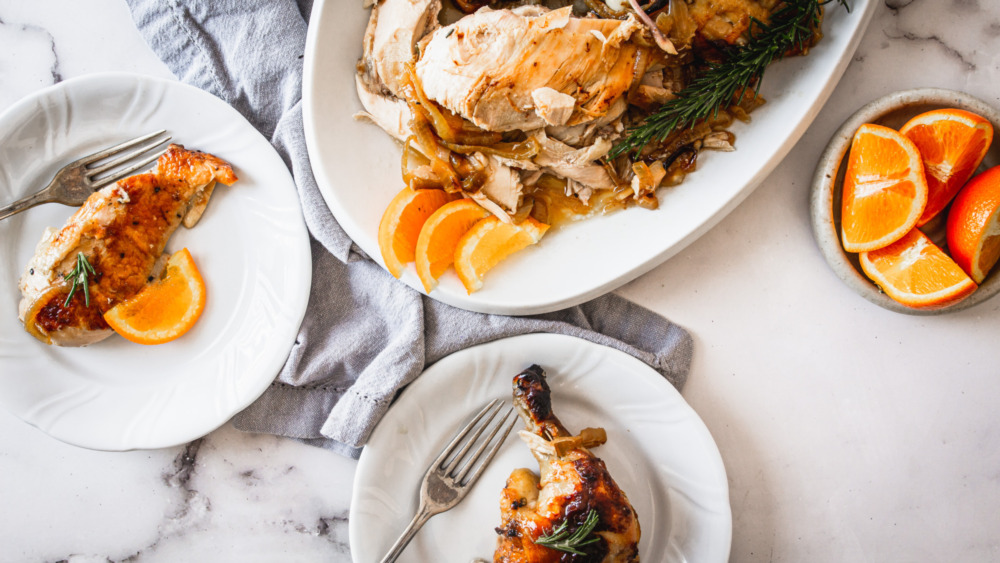 carved chicken and plates