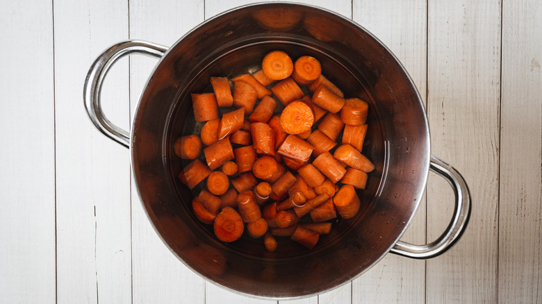 carrots in pot with water