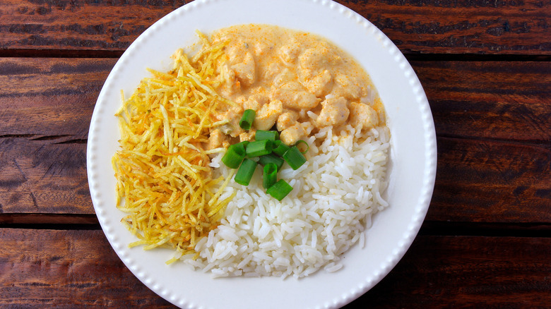 Brazilian chicken stroganoff with potato sticks 