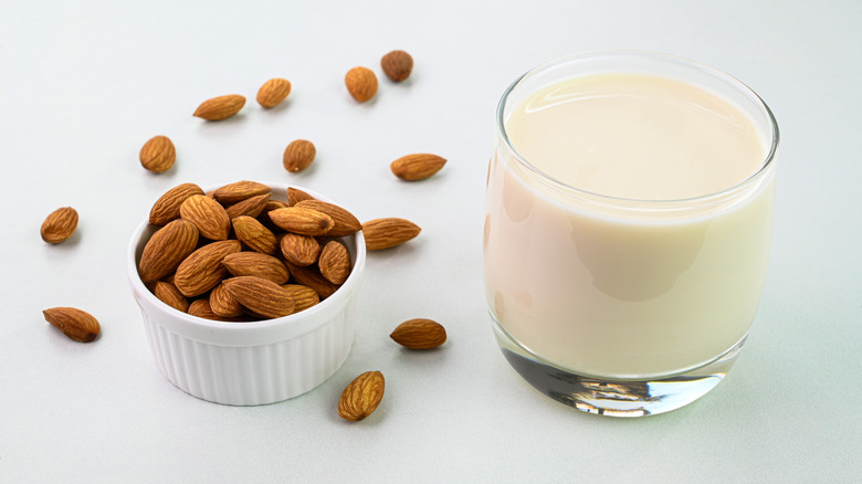 almond milk glass and almonds