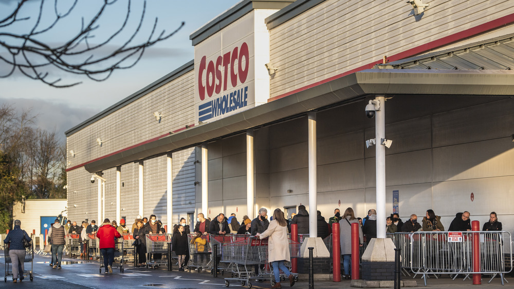 A line of people outside of a Costco