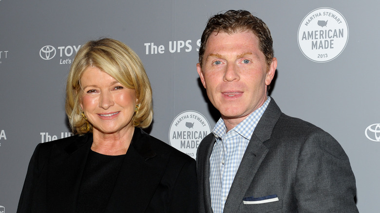 Martha Stewart and Bobby Flay smiling at an event