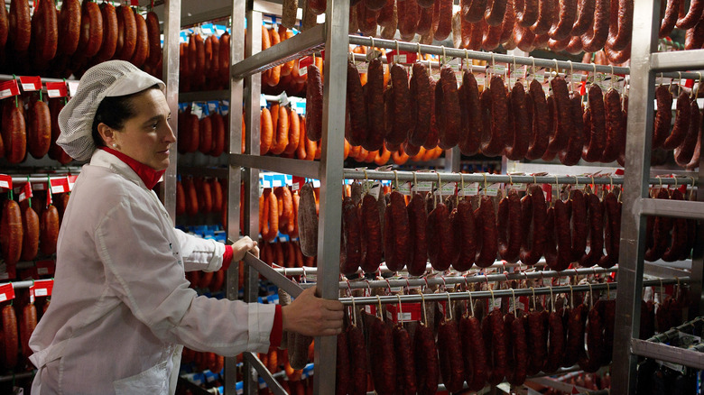 A row of cured sausages