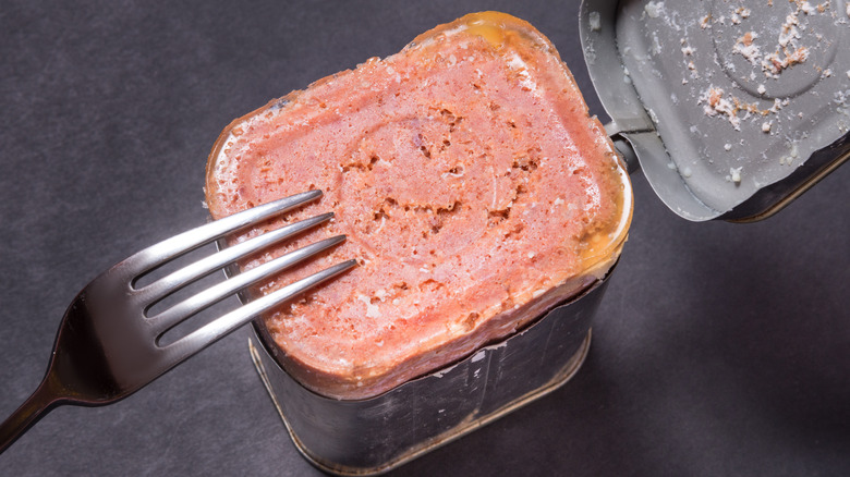 An open can of corned beef