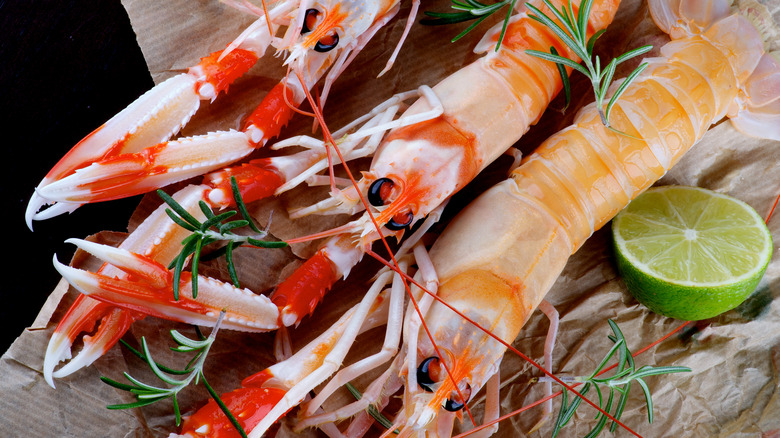 Langoustines on wood cutting board