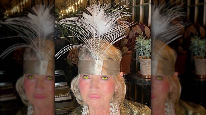 Martha Stewart with feather hat and green eyes