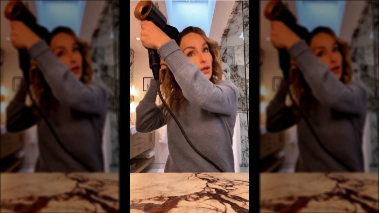 Giada De Laurentiis blow drying hair