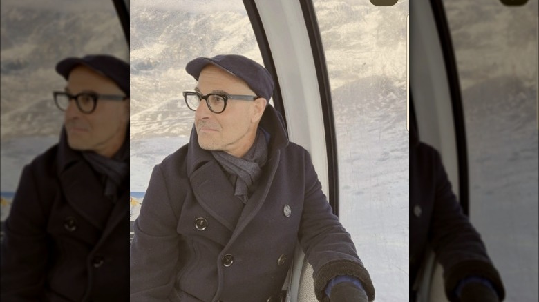 Stanley Tucci sitting in chairlift