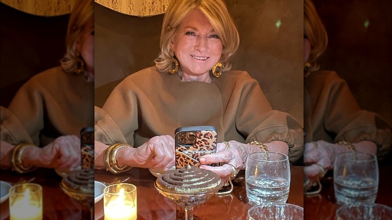 Martha Stewart smiling while dining out at a restaurant