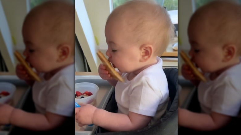 Baby Josephine eating toast