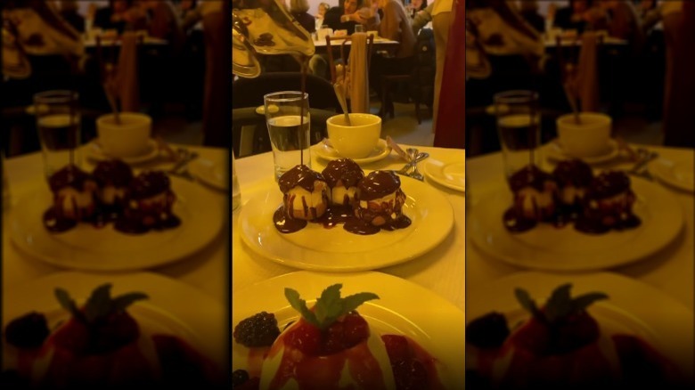 plates of profiteroles and pavlova