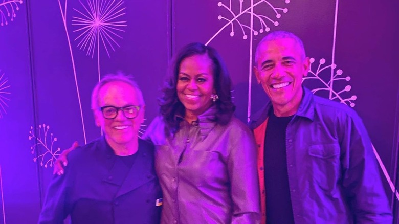 Wolfgang Puck and the Obamas in purple light