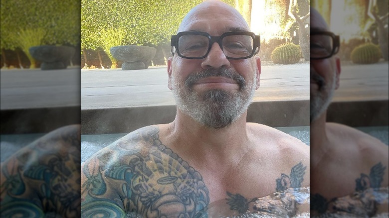 Michael Symon in a hot tub