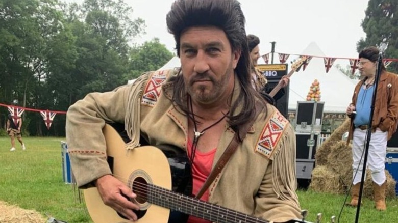 Paul Hollywood with a guitar