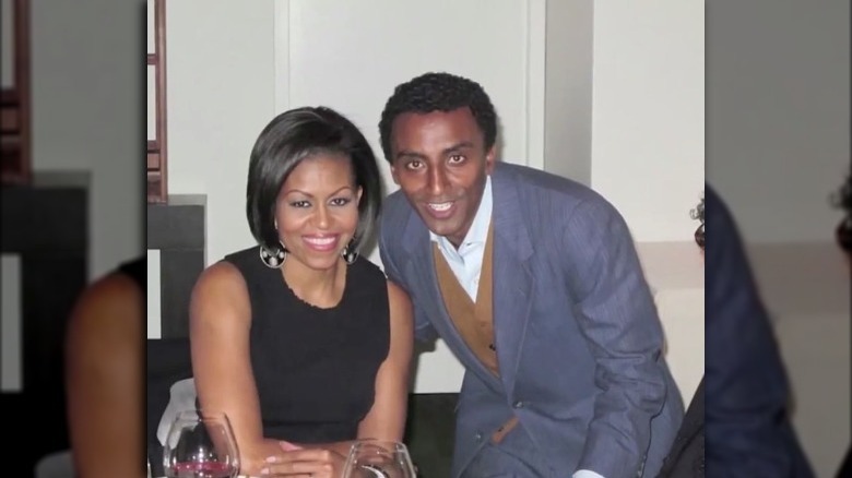 Marcus Samuelsson smiling with Michelle Obama