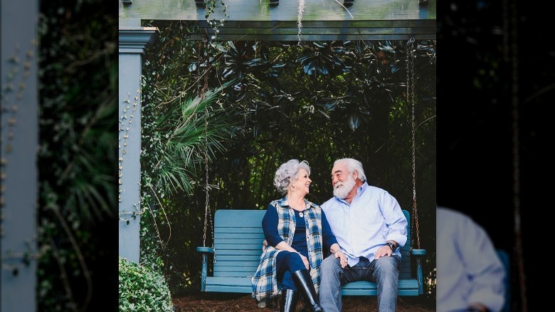 Paula Deen with her husband on a swing