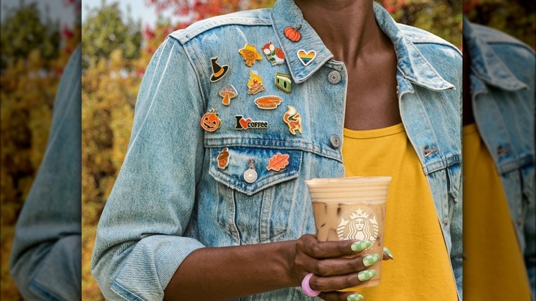 Person holding Starbucks beverage