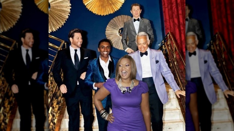 Scott Conant, Marcus Samuelsson, Sunny Anderson, Bobby Flay and Geoffrey Zakarian posing on a staircase.