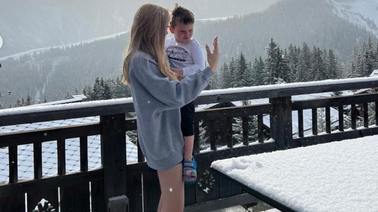 Tilly Ramsay holding Oscar Ramsay at Courchevel