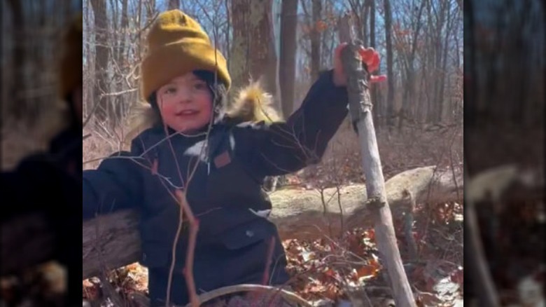 Michael Symon's granddaughter Emmy with stick