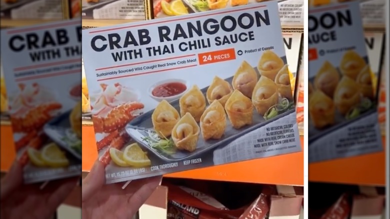 hand holding Costco crab rangoon box