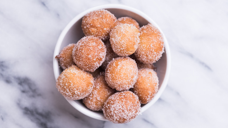 sugared doughnut holes on counter