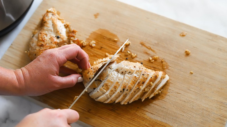 slicing chicken meat