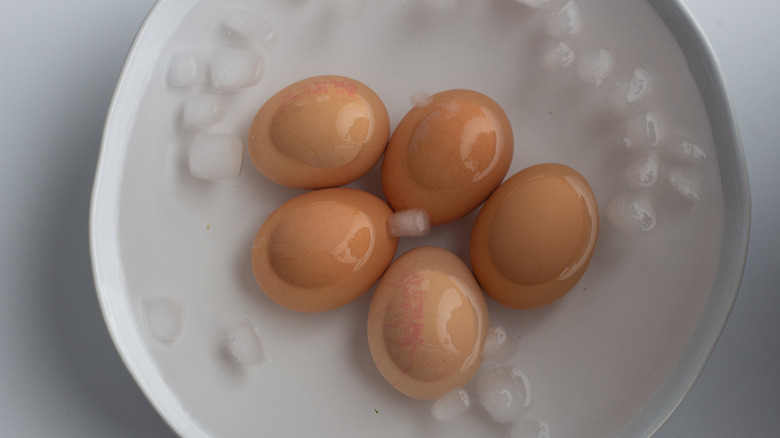 Hard-boiled eggs in bowl of ice water