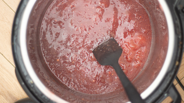 Instant pot full of softened strawberries