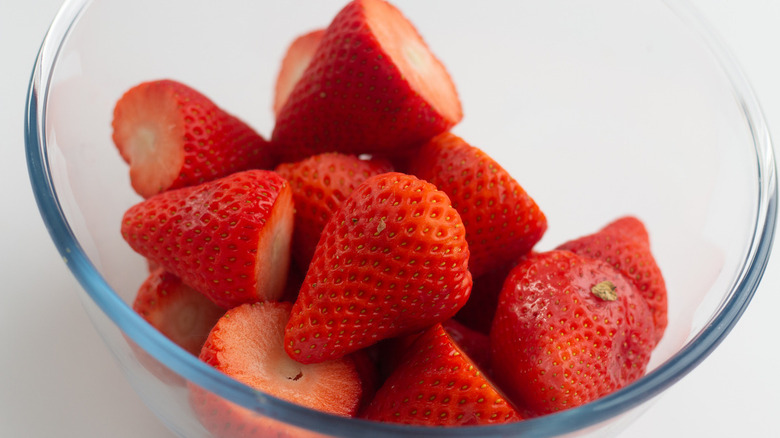 clear glass bowl of fresh red ripe strawberries