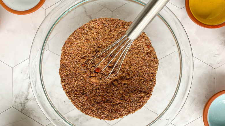 spices in bowl with whisk