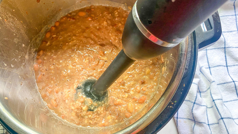 pot of beans with immersion blender