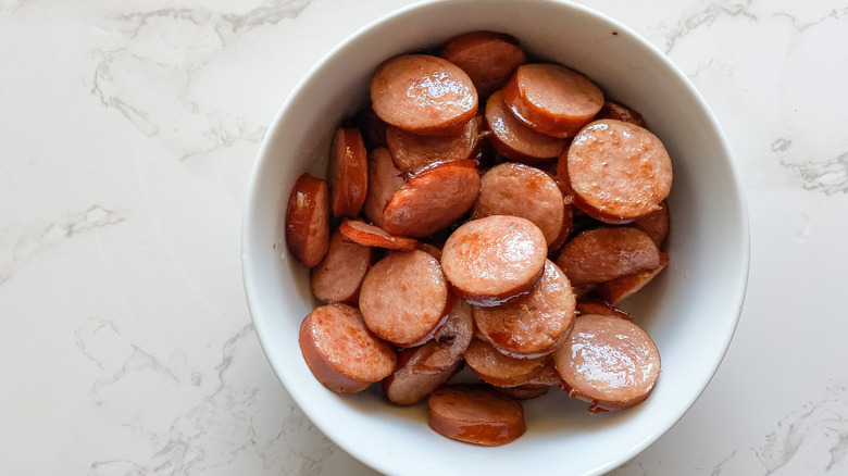 Sliced cooked sausage in a bowl