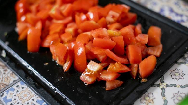 Chopped tomatoes on cutting board