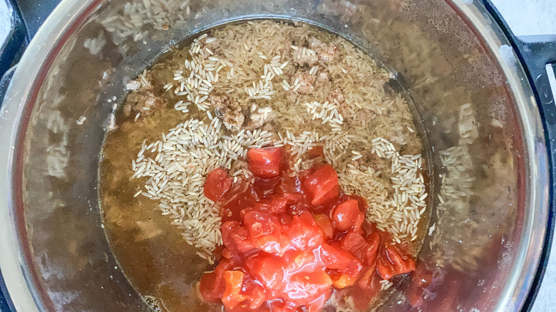 rice and tomatoes in pot