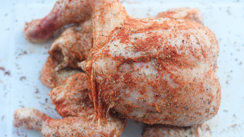 A chicken rubbed with spices