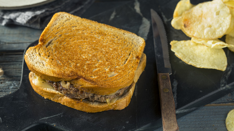 patty melt on cutting board