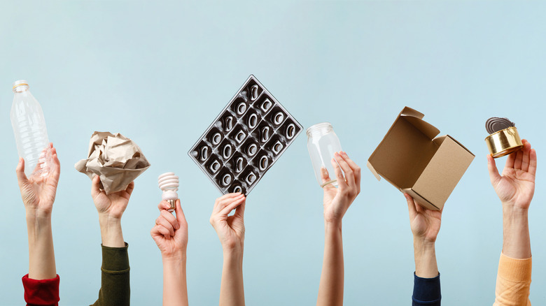 Hands holding recyclables