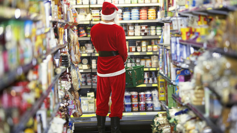 Man dressed as Santa shopping